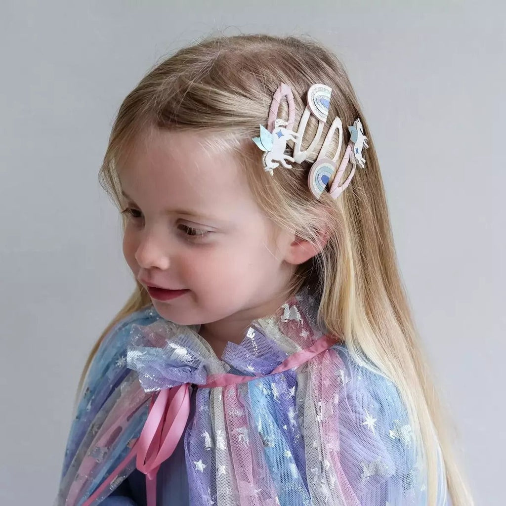 Set of four hair clips featuring unicorn and rainbow designs by Mimi&Lula, colorful and playful accessories for children.