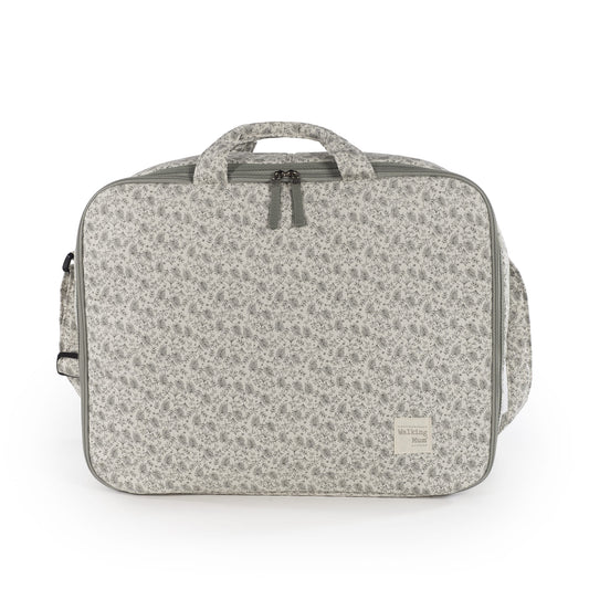 Walking Mum Valigia Gala Mint suitcase with smooth mint green exterior, ergonomic handle, and four spinner wheels for easy travel.