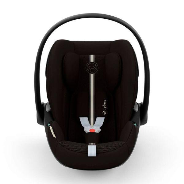 Cybex Cloud G i-Size Plus child car seat with adjustable headrest and safety harness, installed in a vehicle interior.