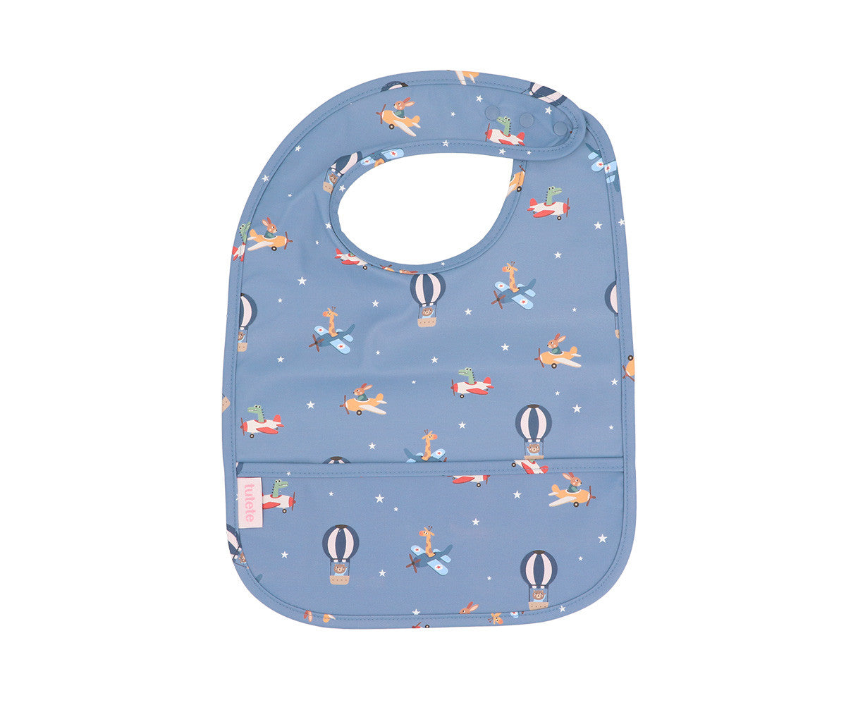 Waterproof bib for babies from Tutete with playful airplane design, perfect for feeding time and keeping clothes clean.