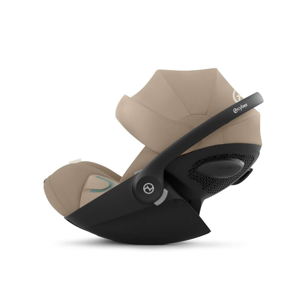 Cybex Cloud G i-Size Plus car seat with adjustable headrest and safety harness, shown installed in a vehicle interior.