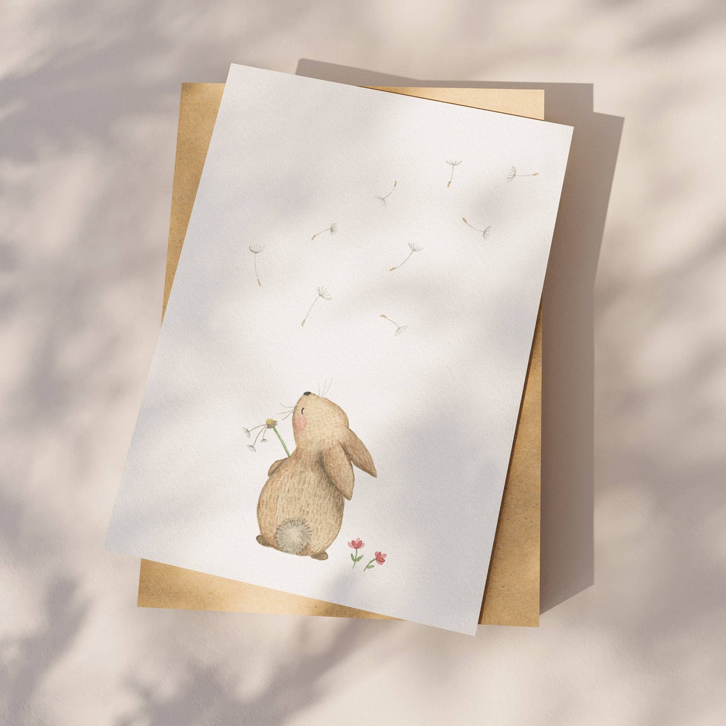 Appeloogje greeting card featuring a rabbit and dandelion illustration with soft pastel colors and whimsical design.