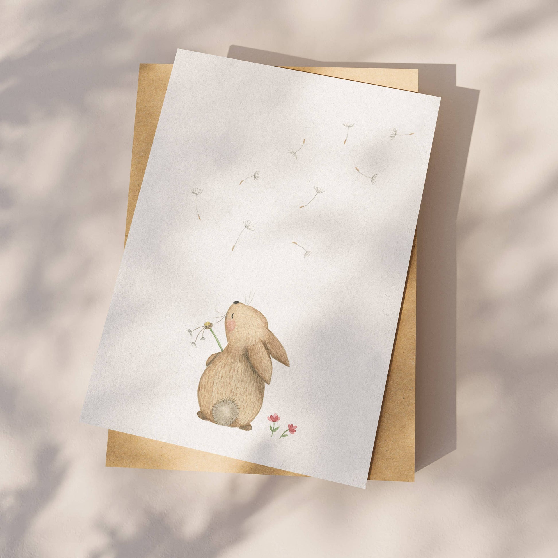 Appeloogje greeting card featuring a rabbit and dandelion illustration with soft pastel colors and whimsical design.