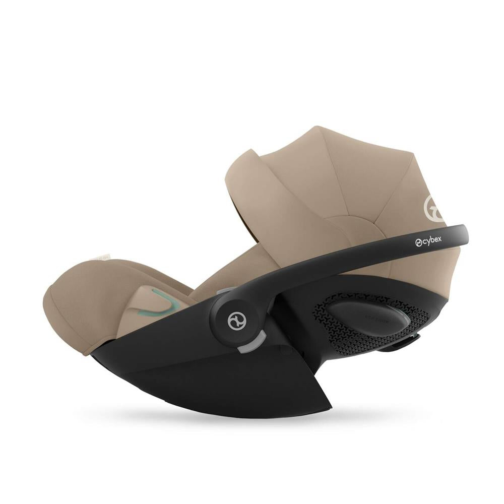 Cybex Cloud G i-Size Plus car seat installed in a vehicle showing its adjustable headrest and safety harness for infants.