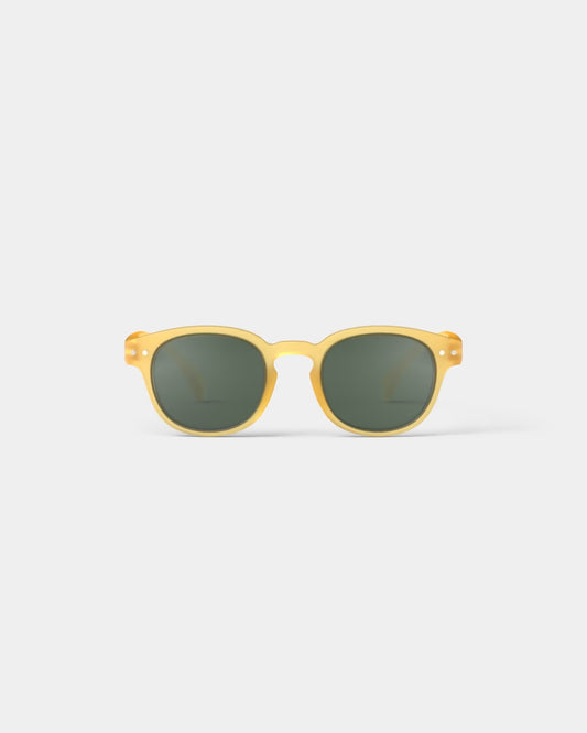 Yellow honey sunglasses for kids aged 5-7 by IZIPIZI, stylish moda eyewear with bright yellow frames and rounded lenses.