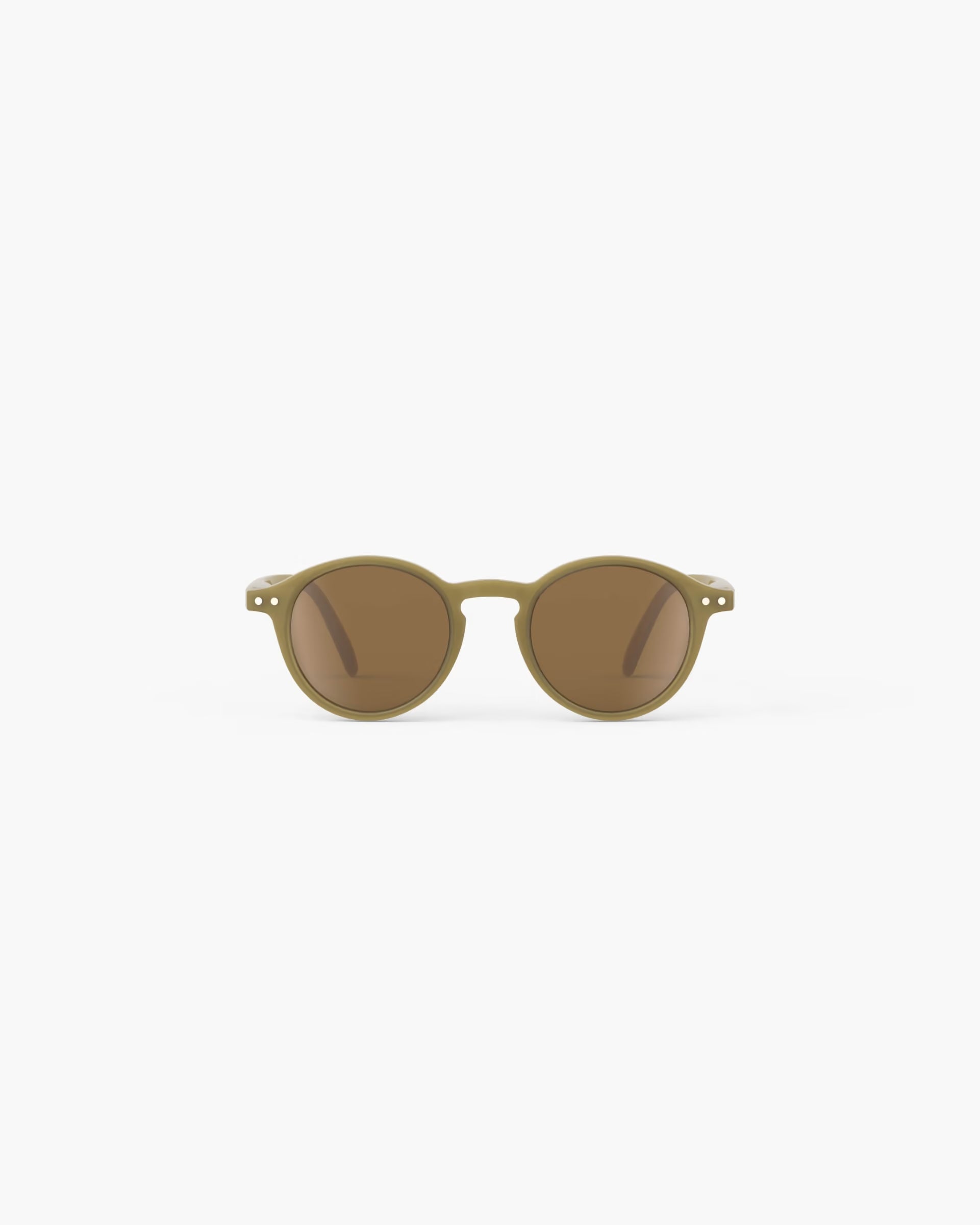 Izpizi kids' olive-colored sunglasses for ages 3-5, stylish and protective sun eyewear for young children in a natural outdoor setting.