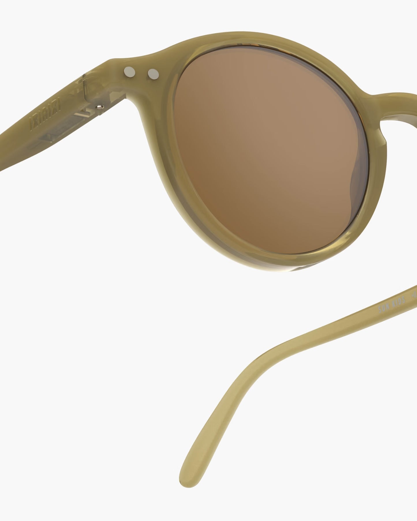 Child's IZIPIZI olive-colored sunglasses for ages 3-5, stylish and lightweight kids' fashion eyewear in a natural outdoor setting